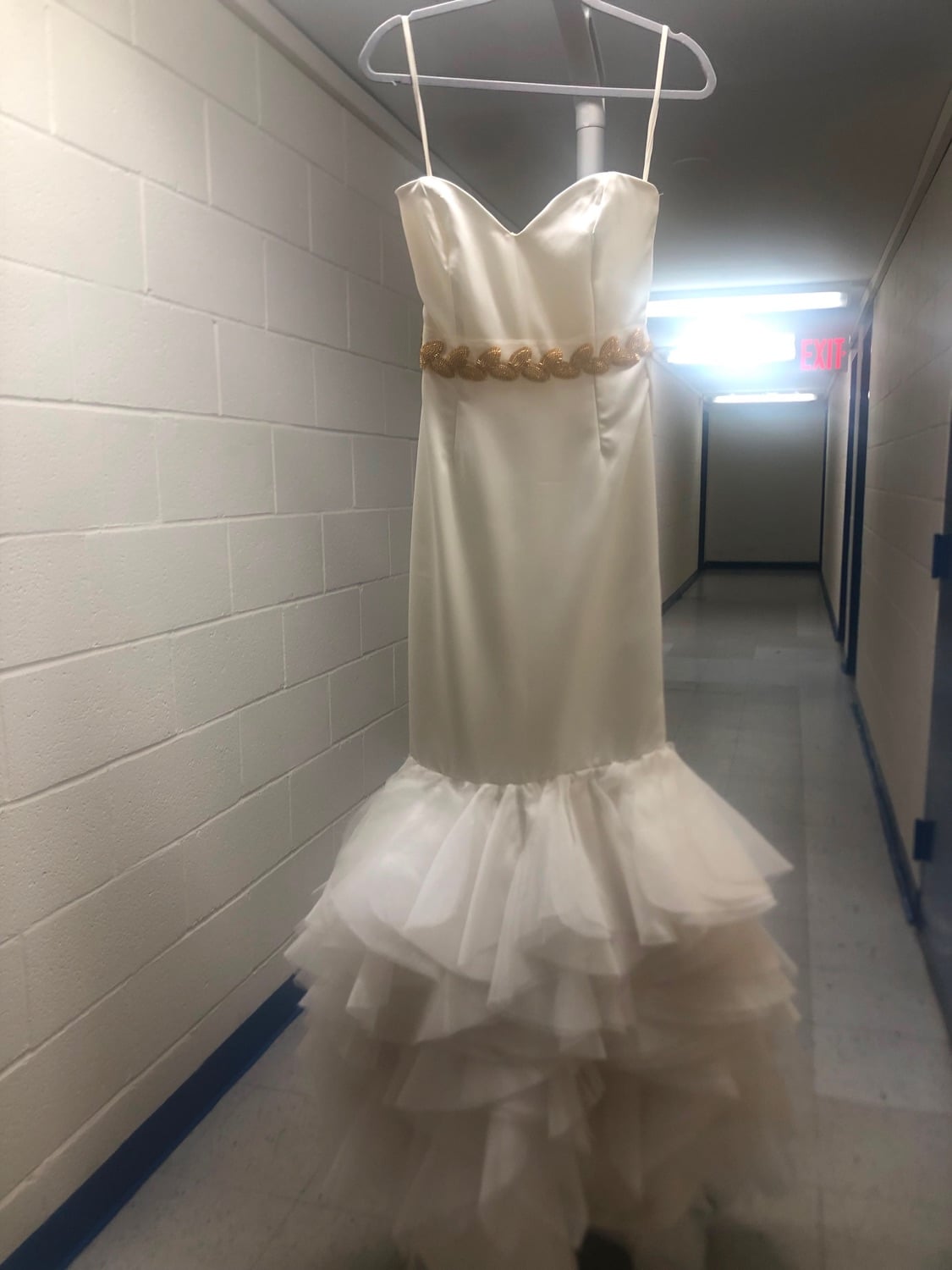 Un vestido marfil con ruedo de sirena en tul.